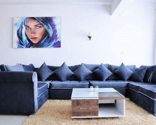 Living room couch in apartment for rent in New Cairo by Axxodia 